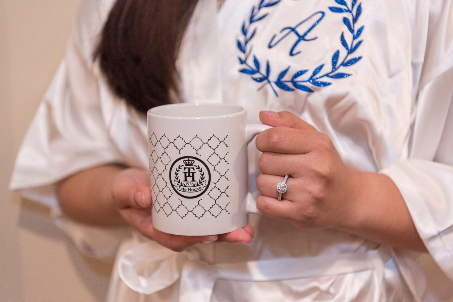 Atlanta Wedding Photographer FAQ - bride holding mug (showing off engagement ring)